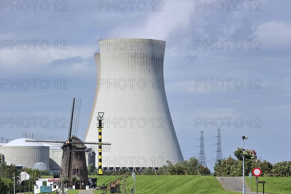 The windmill Scheldedijkmolen and cooling towers of the Doel Nuclear Power Station along the river Scheldt at Kieldrecht