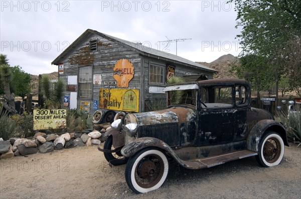 Old Ford vintage car along the Route 66 at the general store of the ghost town Hackberry in Arizona