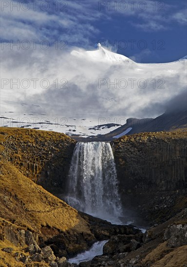 The Snaefellsjoekull with the Svoedufoss waterfall