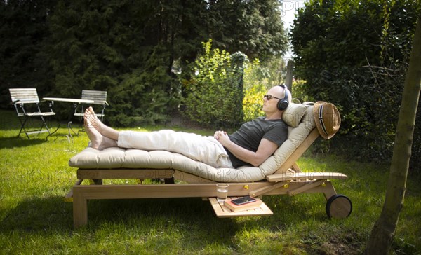 Subject: Relaxation on a lounger in the spring.