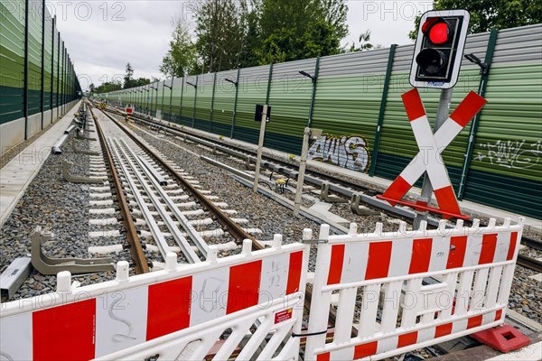 Symbolic photo on the subject of railway infrastructure. A barrier of a construction site stands on a newly built track at Lichtenrade station. Berlin