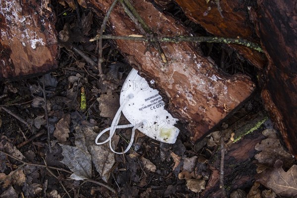 Discarded FFP2 masks lying in nature