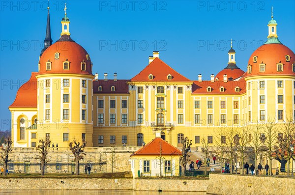 Exterior view of Moritzburg Castle in winter with half-frozen castle pond from the south