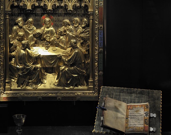 Last Supper relief and religious book at the Ten Duinen museum