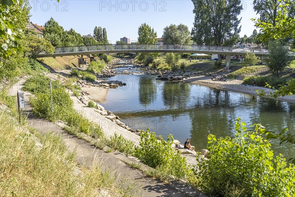 Bridge over the river Birs at Birskoepfli Rhine Park in Basel