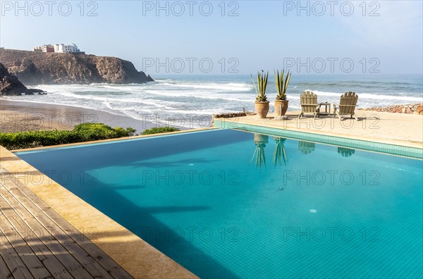 Infinity swimming pool overlooking Atlantic Ocean