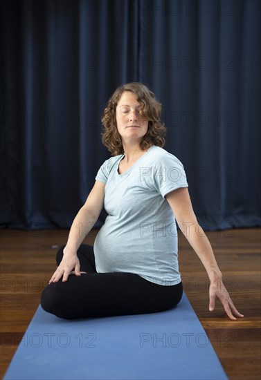 Pregnant woman doing yoga