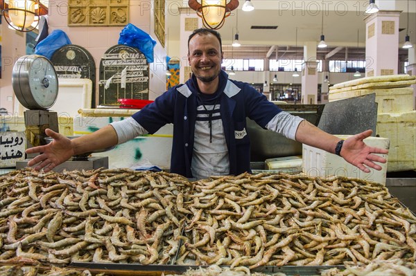 Local fisher man showing his fish