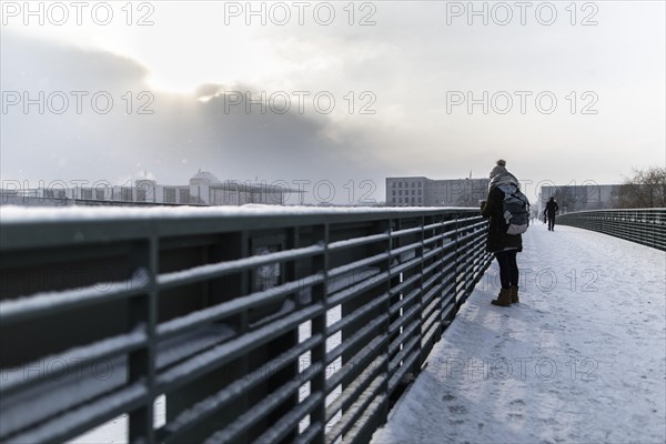 The Reichstag building stands out in the sunshine after heavy snowfall in the government district in Berlin