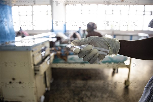 Nurse holding syringes at Princess Christian Hospital in Sierra Leone