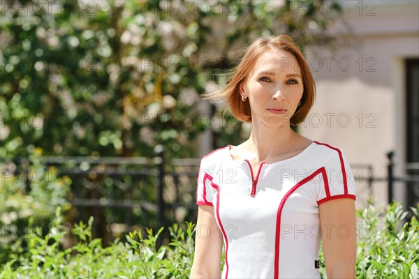 Medium closeup portrait of fitness sport redhead woman