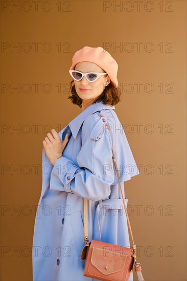 Pretty woman in blue coat