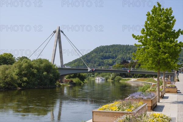 Flower tubs on the banks of the Weser and bridge over the Weser