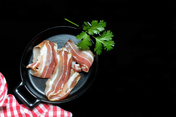 Bacon strips in pans