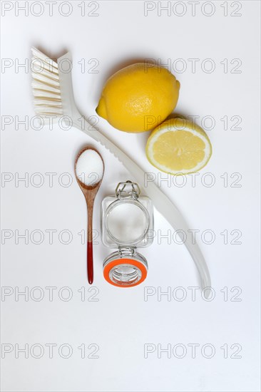 Citric acid in wooden spoon and glass container