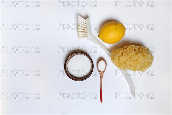 Citric acid in wooden spoon and small bowl