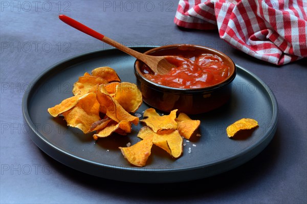 Sweet crisps and salsa sauce on plate