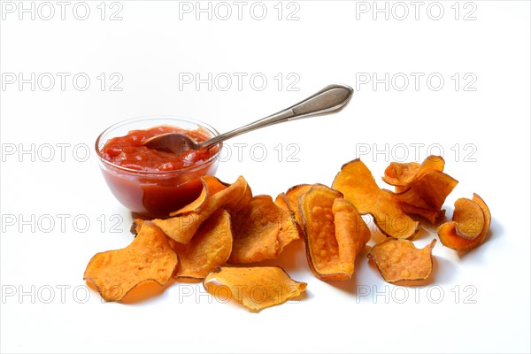 Sweet crisps and salsa sauce in small bowls