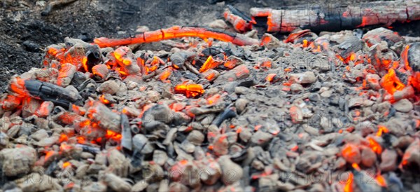 Smoldering coals on the ground