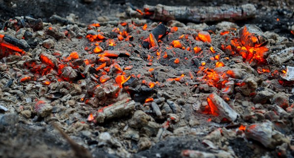 Smoldering coals on the ground