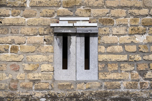 Mailboxes integrated into a brick wall
