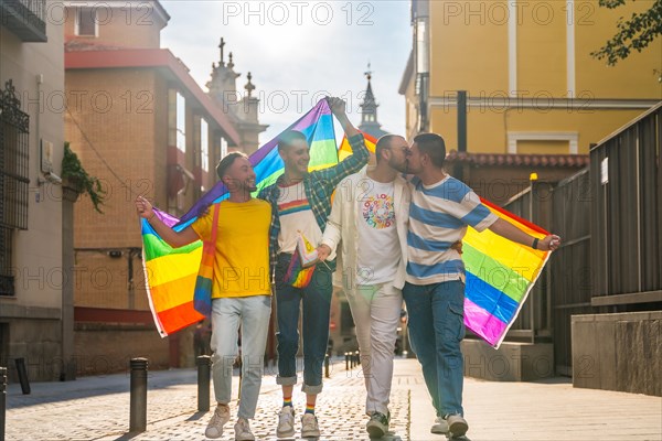Lifestyle of embraced homosexual friends walking at the gay pride party in the city