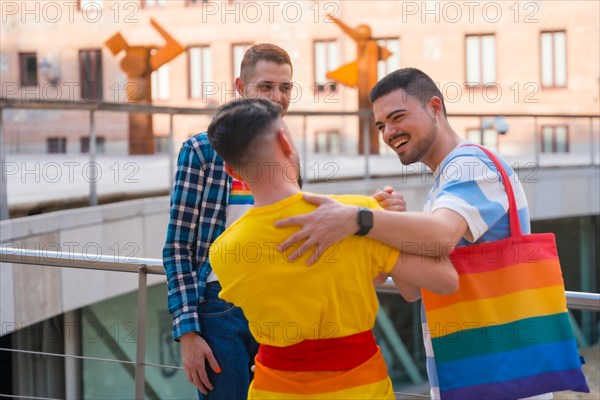 Friends waving and hugging at the demonstration with the rainbow flags