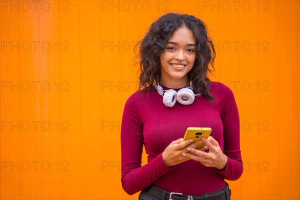Portrait of latin woman with headphones smiling