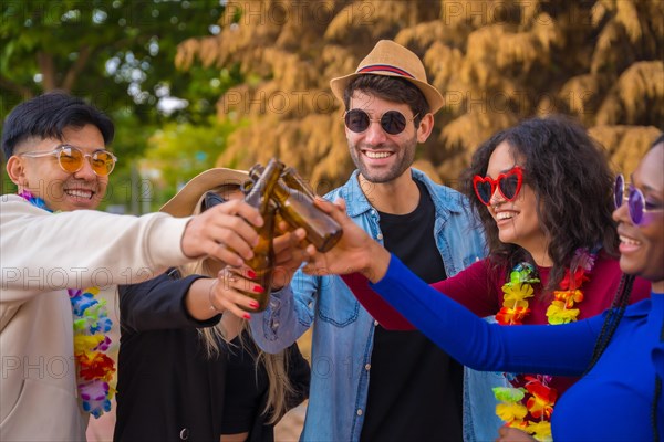 Group of multi ethnic friends partying in a park