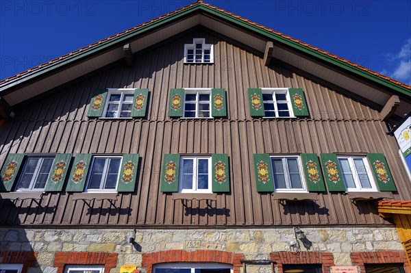 Façade with green shutters