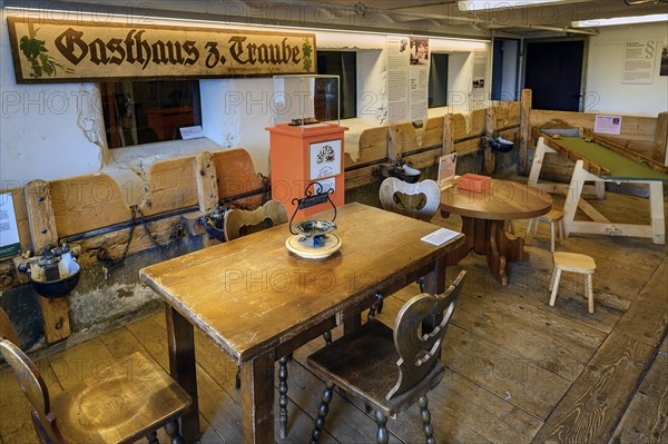 Former cowshed with drinking troughs and chains