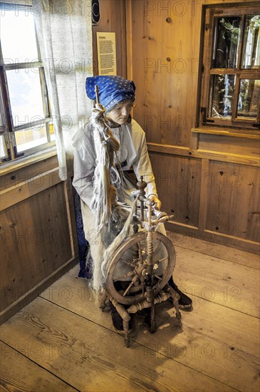 Figure of a flax spinner with spinning wheel