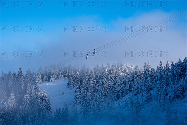 Above the clouds under a blue sky