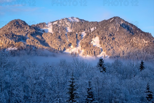 Sun shines on the wintry mountain Brauneck