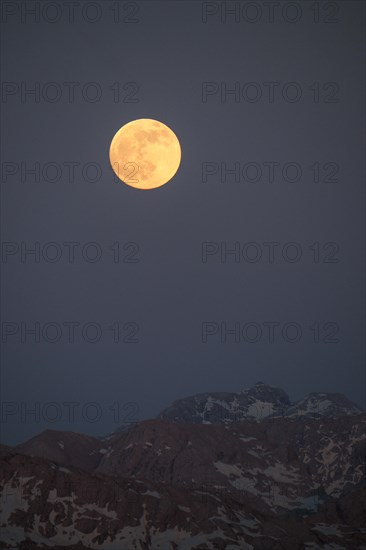 The full moon rises above the Hochkönig and Matrashaus