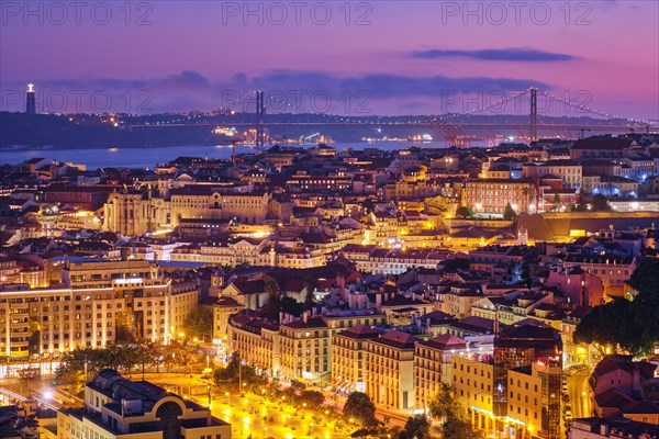 Night view of Lisbon famous view from Miradouro da Senhora do Monte tourist viewpoint of Alfama and Mauraria old city districts