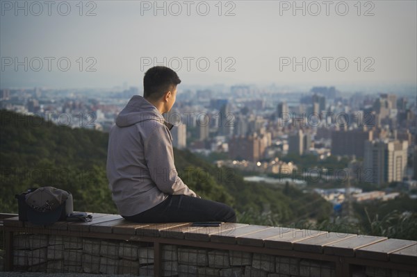 Man looking at ctyscape of Taoyuan