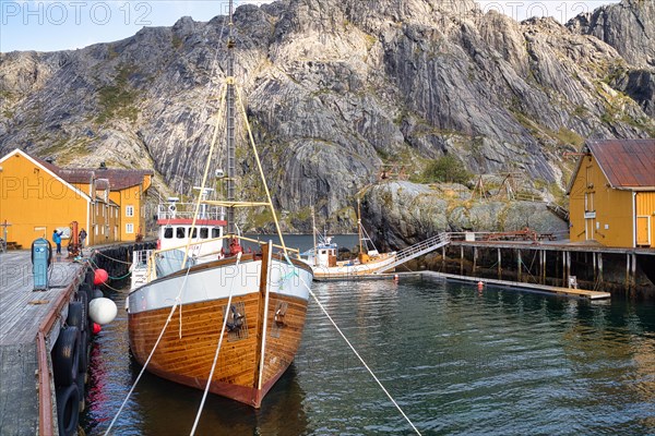 Historic buildings and fishing boats in Nusfjord harbour