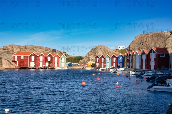 Fishing boats and colourful boathouses in the harbour of Smögen