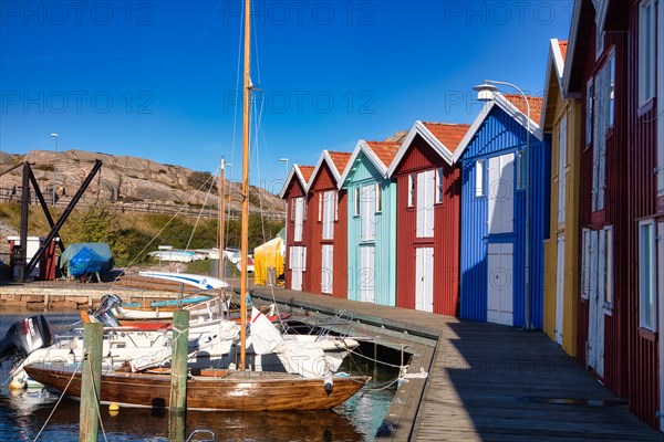 Fishing boats and colourful boathouses in the harbour of Smögen