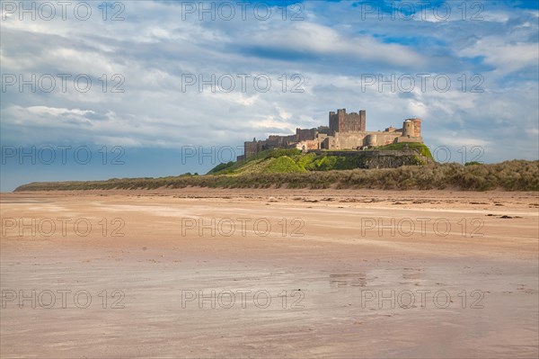 Flat sandy coast with Bamburgh Castle