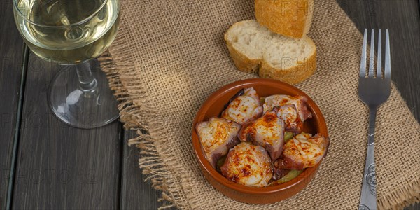 Galician octopus typical food from the north of Spain with sweet paprika salt and Andalusian olive oil exquisite tapa