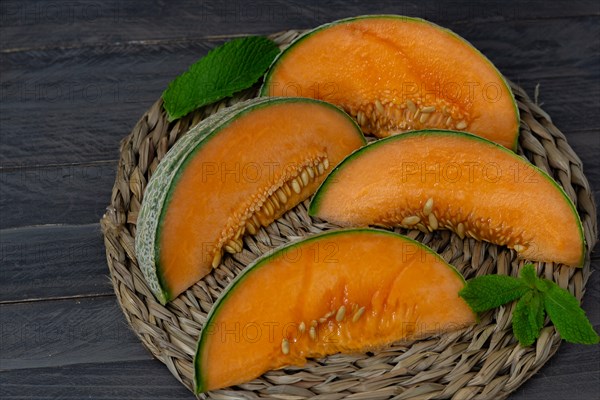 Cantaloupe melon on black background dark food