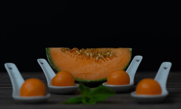 Cantaloupe melon on black background dark food