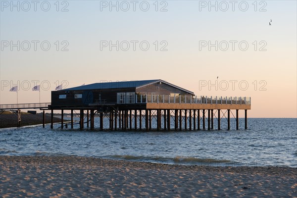 House on wooden stilts on the beach