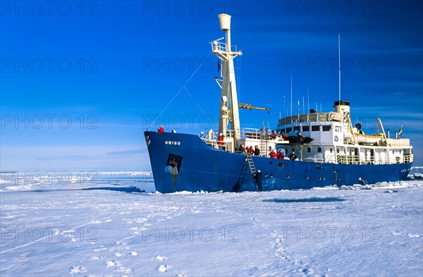 Ship with tourist at the ice edge in arctic