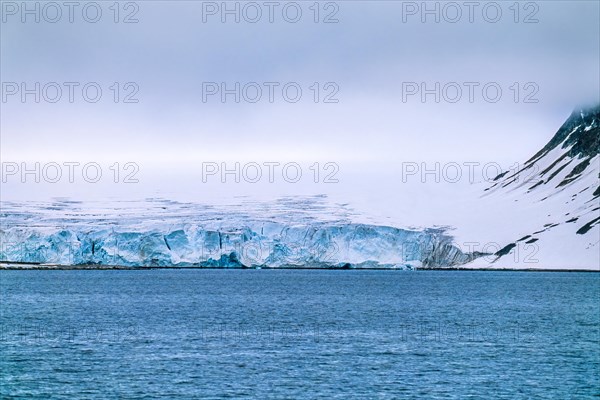 Glacier at the sea in Svalbard island