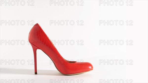 Bright red shoes on the white background