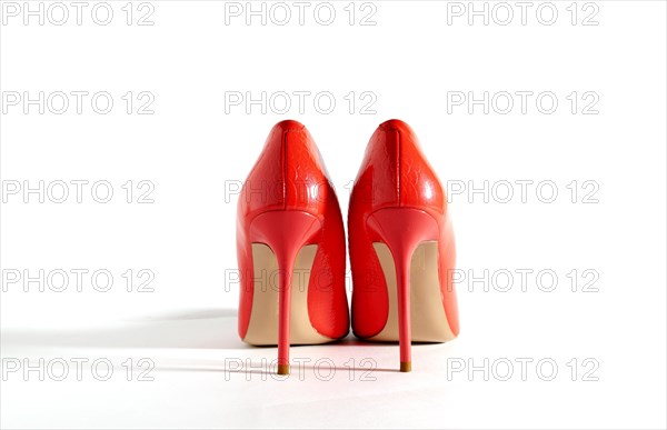 Bright red shoes on the white background