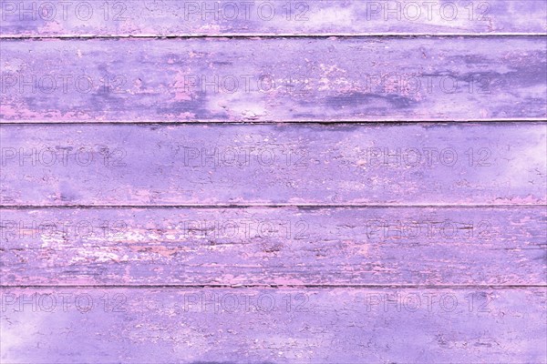 Wooden background with violet painted planks